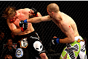 CHICAGO, IL - JANUARY 26:  Pascal Krauss (R) punches Mike Stumpf (L) during their Welterweight Bout part of UFC on FOX at United Center on January 26, 2013 in Chicago, Illinois.  (Photo by Al Bello/Zuffa LLC/Zuffa LLC Via Getty Images)