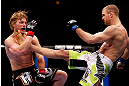 CHICAGO, IL - JANUARY 26:  Pascal Krauss (L) kicks Mike Stumpf (R) during their Welterweight Bout part of UFC on FOX at United Center on January 26, 2013 in Chicago, Illinois.  (Photo by Josh Hedges/Zuffa LLC/Zuffa LLC Via Getty Images)