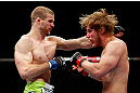 CHICAGO, IL - JANUARY 26:  Pascal Krauss (L) punches Mike Stumpf (R) during their Welterweight Bout part of UFC on FOX at United Center on January 26, 2013 in Chicago, Illinois.  (Photo by Josh Hedges/Zuffa LLC/Zuffa LLC Via Getty Images)