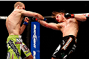 CHICAGO, IL - JANUARY 26:  Pascal Krauss (L) punches Mike Stumpf (R) during their Welterweight Bout part of UFC on FOX at United Center on January 26, 2013 in Chicago, Illinois.  (Photo by Josh Hedges/Zuffa LLC/Zuffa LLC Via Getty Images)