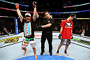 CHICAGO, IL - JANUARY 26:  Clay Guida (L) celebrates defeating Hatsu Hioki (R) during their Featherweight Bout part of UFC on FOX at United Center on January 26, 2013 in Chicago, Illinois.  (Photo by Al Bello/Zuffa LLC/Zuffa LLC Via Getty Images)