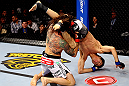 CHICAGO, IL - JANUARY 26:  Clay Guida (L) dumps Hatsu Hioki (R) during their Featherweight Bout part of UFC on FOX at United Center on January 26, 2013 in Chicago, Illinois.  (Photo by Al Bello/Zuffa LLC/Zuffa LLC Via Getty Images)