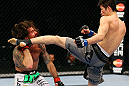 CHICAGO, IL - JANUARY 26:  Hatsu Hioki (R) kicks Clay Guida (L) during their Featherweight Bout part of UFC on FOX at United Center on January 26, 2013 in Chicago, Illinois.  (Photo by Al Bello/Zuffa LLC/Zuffa LLC Via Getty Images)