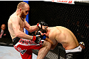 CHICAGO, IL - JANUARY 26:  TJ Grant (L) knees Matt Wiman (R) during their Lightweight Bout part of UFC on FOX at United Center on January 26, 2013 in Chicago, Illinois.  (Photo by Al Bello/Zuffa LLC/Zuffa LLC Via Getty Images)
