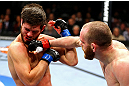 CHICAGO, IL - JANUARY 26:  TJ Grant (R) punches Matt Wiman (L) during their Lightweight Bout part of UFC on FOX at United Center on January 26, 2013 in Chicago, Illinois.  (Photo by Al Bello/Zuffa LLC/Zuffa LLC Via Getty Images)