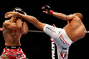 CHICAGO, IL - JANUARY 26:  Erik Koch (R) kicks Ricardo Lamas (L) during their Featherweight Bout part of UFC on FOX at United Center on January 26, 2013 in Chicago, Illinois.  (Photo by Josh Hedges/Zuffa LLC/Zuffa LLC Via Getty Images)