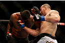 CHICAGO, IL - JANUARY 26:  Glover Teixeira (R) punches Rampage Jackson (L) during their Light Heavyweight Bout part of UFC on FOX at United Center on January 26, 2013 in Chicago, Illinois.  (Photo by Josh Hedges/Zuffa LLC/Zuffa LLC Via Getty Images)