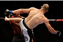 CHICAGO, IL - JANUARY 26:  Glover Teixeira (R) kicks Rampage Jackson (L) during their Light Heavyweight Bout part of UFC on FOX at United Center on January 26, 2013 in Chicago, Illinois.  (Photo by Josh Hedges/Zuffa LLC/Zuffa LLC Via Getty Images)