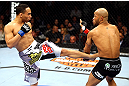 CHICAGO, IL - JANUARY 26:  John Dodson (L) kicks Demetrious Johnson (R) during thier Flyweight Championship Bout part of UFC on FOX at United Center on January 26, 2013 in Chicago, Illinois.  (Photo by Al Bello/Zuffa LLC/Zuffa LLC Via Getty Images)
