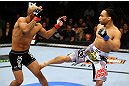 CHICAGO, IL - JANUARY 26:  John Dodson (R) kicks Demetrious Johnson (L) during thier Flyweight Championship Bout part of UFC on FOX at United Center on January 26, 2013 in Chicago, Illinois.  (Photo by Al Bello/Zuffa LLC/Zuffa LLC Via Getty Images)