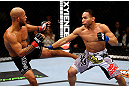 CHICAGO, IL - JANUARY 26:  Demetrious Johnson (L) kicks John Dodson (R) during thier Flyweight Championship Bout part of UFC on FOX at United Center on January 26, 2013 in Chicago, Illinois.  (Photo by Al Bello/Zuffa LLC/Zuffa LLC Via Getty Images)