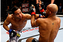 CHICAGO, IL - JANUARY 26:  John Dodson (L) punches Demetrious Johnson (R) during thier Flyweight Championship Bout part of UFC on FOX at United Center on January 26, 2013 in Chicago, Illinois.  (Photo by Al Bello/Zuffa LLC/Zuffa LLC Via Getty Images)