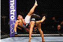 CHICAGO, IL - JANUARY 26:  John Dodson (L) gets dumped by Demetrious Johnson (R) during thier Flyweight Championship Bout part of UFC on FOX at United Center on January 26, 2013 in Chicago, Illinois.  (Photo by Al Bello/Zuffa LLC/Zuffa LLC Via Getty Images)
