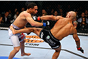 CHICAGO, IL - JANUARY 26:  Demetrious Johnson (R) kicks John Dodson (L) during thier Flyweight Championship Bout part of UFC on FOX at United Center on January 26, 2013 in Chicago, Illinois.  (Photo by Al Bello/Zuffa LLC/Zuffa LLC Via Getty Images)