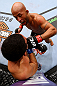 CHICAGO, IL - JANUARY 26:  Demetrious Johnson (Top) punches John Dodson (Bottom) during thier Flyweight Championship Bout part of UFC on FOX at United Center on January 26, 2013 in Chicago, Illinois.  (Photo by Al Bello/Zuffa LLC/Zuffa LLC Via Getty Images)