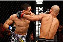 CHICAGO, IL - JANUARY 26:  John Dodson (L) punches Demetrious Johnson (R) during thier Flyweight Championship Bout part of UFC on FOX at United Center on January 26, 2013 in Chicago, Illinois.  (Photo by Josh Hedges/Zuffa LLC/Zuffa LLC Via Getty Images)