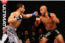 CHICAGO, IL - JANUARY 26:  John Dodson (L) punches Demetrious Johnson (R) during thier Flyweight Championship Bout part of UFC on FOX at United Center on January 26, 2013 in Chicago, Illinois.  (Photo by Josh Hedges/Zuffa LLC/Zuffa LLC Via Getty Images)