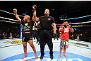 CHICAGO, IL - JANUARY 26:  Demetrious Johnson (L) celebrates defeating John Dodson (R) during thier Flyweight Championship Bout part of UFC on FOX at United Center on January 26, 2013 in Chicago, Illinois.  (Photo by Al Bello/Zuffa LLC/Zuffa LLC Via Getty Images)