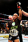 CHICAGO, IL - JANUARY 26:  Demetrious Johnson celebrates defeating John Dodson during thier Flyweight Championship Bout part of UFC on FOX at United Center on January 26, 2013 in Chicago, Illinois.  (Photo by Al Bello/Zuffa LLC/Zuffa LLC Via Getty Images)