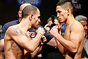 LAS VEGAS, NV - FEBRUARY 01:  (L-R) Opponents Chico Camus and Dustin Kimura face off during the UFC 156 weigh-in on February 1, 2013 at Mandalay Bay Events Center in Las Vegas, Nevada.  (Photo by Josh Hedges/Zuffa LLC/Zuffa LLC via Getty Images)