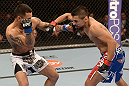 LAS VEGAS, NV - FEBRUARY 02:  (R-L) Edwin Figueroa punches Francisco Rivera during their bantamweight fight at UFC 156 on February 2, 2013 at the Mandalay Bay Events Center in Las Vegas, Nevada.  (Photo by Donald Miralle/Zuffa LLC/Zuffa LLC via Getty Images) *** Local Caption *** Francisco Rivera; Edwin Figueroa