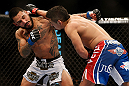 LAS VEGAS, NV - FEBRUARY 02:  Edwin Figueroa (right) punches Francisco Rivera during their bantamweight fight at UFC 156 on February 2, 2013 at the Mandalay Bay Events Center in Las Vegas, Nevada.  (Photo by Josh Hedges/Zuffa LLC/Zuffa LLC via Getty Images) *** Local Caption *** Francisco Rivera; Edwin Figueroa