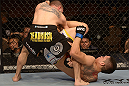 LAS VEGAS, NV - FEBRUARY 02:  (R-L) Dustin Kimura attempts to submit Chico Camus during their bantamweight fight at UFC 156 on February 2, 2013 at the Mandalay Bay Events Center in Las Vegas, Nevada.  (Photo by Donald Miralle/Zuffa LLC/Zuffa LLC via Getty Images) *** Local Caption *** Chico Camus; Dustin Kimura