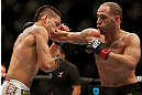LAS VEGAS, NV - FEBRUARY 02:  (R-L) Chico Camus punches Dustin Kimura during their bantamweight fight at UFC 156 on February 2, 2013 at the Mandalay Bay Events Center in Las Vegas, Nevada.  (Photo by Josh Hedges/Zuffa LLC/Zuffa LLC via Getty Images) *** Local Caption *** Chico Camus; Dustin Kimura
