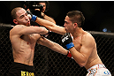 LAS VEGAS, NV - FEBRUARY 02:  (R-L) Dustin Kimura punches Chico Camus during their bantamweight fight at UFC 156 on February 2, 2013 at the Mandalay Bay Events Center in Las Vegas, Nevada.  (Photo by Josh Hedges/Zuffa LLC/Zuffa LLC via Getty Images) *** Local Caption *** Chico Camus; Dustin Kimura