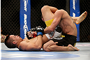 LAS VEGAS, NV - FEBRUARY 02:  Dustin Kimura (left) attempts to submit Chico Camus during their bantamweight fight at UFC 156 on February 2, 2013 at the Mandalay Bay Events Center in Las Vegas, Nevada.  (Photo by Josh Hedges/Zuffa LLC/Zuffa LLC via Getty Images) *** Local Caption *** Chico Camus; Dustin Kimura