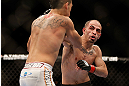 LAS VEGAS, NV - FEBRUARY 02:  (R-L) Chico Camus punches Dustin Kimura during their bantamweight fight at UFC 156 on February 2, 2013 at the Mandalay Bay Events Center in Las Vegas, Nevada.  (Photo by Josh Hedges/Zuffa LLC/Zuffa LLC via Getty Images) *** Local Caption *** Chico Camus; Dustin Kimura