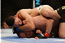 LAS VEGAS, NV - FEBRUARY 02:  Dustin Kimura (top) attempts to submit Chico Camus during their bantamweight fight at UFC 156 on February 2, 2013 at the Mandalay Bay Events Center in Las Vegas, Nevada.  (Photo by Josh Hedges/Zuffa LLC/Zuffa LLC via Getty Images) *** Local Caption *** Chico Camus; Dustin Kimura