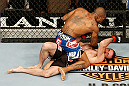 LAS VEGAS, NV - FEBRUARY 02:  Bobby Green (top) punches Jacob Volkmann during their lightweight fight at UFC 156 on February 2, 2013 at the Mandalay Bay Events Center in Las Vegas, Nevada.  (Photo by Josh Hedges/Zuffa LLC/Zuffa LLC via Getty Images) *** Local Caption *** Jacob Volkmann; Bobby Green