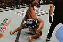 LAS VEGAS, NV - FEBRUARY 02:  Tyron Woodley (top) punches Jay Hieron during their welterweight fight at UFC 156 on February 2, 2013 at the Mandalay Bay Events Center in Las Vegas, Nevada.  (Photo by Donald Miralle/Zuffa LLC/Zuffa LLC via Getty Images) *** Local Caption *** Jay Hieron; Tyron Woodley