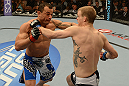 LAS VEGAS, NV - FEBRUARY 02:  (L-R) Gleison Tibau punches Evan Dunham during their lightweight fight at UFC 156 on February 2, 2013 at the Mandalay Bay Events Center in Las Vegas, Nevada.  (Photo by Donald Miralle/Zuffa LLC/Zuffa LLC via Getty Images) *** Local Caption *** Gleison Tibau; Evan Dunham