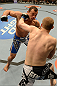 LAS VEGAS, NV - FEBRUARY 02:  Evan Dunham (black trunks) punches Gleison Tibau during their lightweight fight at UFC 156 on February 2, 2013 at the Mandalay Bay Events Center in Las Vegas, Nevada.  (Photo by Donald Miralle/Zuffa LLC/Zuffa LLC via Getty Images) *** Local Caption *** Gleison Tibau; Evan Dunham