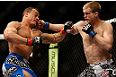 LAS VEGAS, NV - FEBRUARY 02:  (R-L) Evan Dunham punches Gleison Tibau during their lightweight fight at UFC 156 on February 2, 2013 at the Mandalay Bay Events Center in Las Vegas, Nevada.  (Photo by Josh Hedges/Zuffa LLC/Zuffa LLC via Getty Images) *** Local Caption *** Gleison Tibau; Evan Dunham