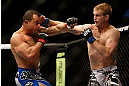 LAS VEGAS, NV - FEBRUARY 02:  (R-L) Evan Dunham punches Gleison Tibau during their lightweight fight at UFC 156 on February 2, 2013 at the Mandalay Bay Events Center in Las Vegas, Nevada.  (Photo by Josh Hedges/Zuffa LLC/Zuffa LLC via Getty Images) *** Local Caption *** Gleison Tibau; Evan Dunham