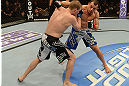 LAS VEGAS, NV - FEBRUARY 02:  (R-L) Gleison Tibau punches Evan Dunham during their lightweight fight at UFC 156 on February 2, 2013 at the Mandalay Bay Events Center in Las Vegas, Nevada.  (Photo by Donald Miralle/Zuffa LLC/Zuffa LLC via Getty Images) *** Local Caption *** Gleison Tibau; Evan Dunham