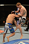 LAS VEGAS, NV - FEBRUARY 02:  (R-L) Evan Dunham knees Gleison Tibau during their lightweight fight at UFC 156 on February 2, 2013 at the Mandalay Bay Events Center in Las Vegas, Nevada.  (Photo by Donald Miralle/Zuffa LLC/Zuffa LLC via Getty Images) *** Local Caption *** Gleison Tibau; Evan Dunham
