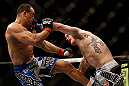 LAS VEGAS, NV - FEBRUARY 02:  (R-L) Evan Dunham punches Gleison Tibau during their lightweight fight at UFC 156 on February 2, 2013 at the Mandalay Bay Events Center in Las Vegas, Nevada.  (Photo by Josh Hedges/Zuffa LLC/Zuffa LLC via Getty Images) *** Local Caption *** Gleison Tibau; Evan Dunham