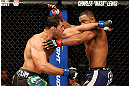 LAS VEGAS, NV - FEBRUARY 02:  (L-R) Antonio Rogerio Nogueira punches Rashad Evans during their light heavyweight fight at UFC 156 on February 2, 2013 at the Mandalay Bay Events Center in Las Vegas, Nevada.  (Photo by Josh Hedges/Zuffa LLC/Zuffa LLC via Getty Images) *** Local Caption *** Rashad Evans; Antonio Rogerio Nogueira