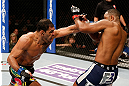 LAS VEGAS, NV - FEBRUARY 02:  (L-R) Antonio Rogerio Nogueira punches Rashad Evans during their light heavyweight fight at UFC 156 on February 2, 2013 at the Mandalay Bay Events Center in Las Vegas, Nevada.  (Photo by Josh Hedges/Zuffa LLC/Zuffa LLC via Getty Images) *** Local Caption *** Rashad Evans; Antonio Rogerio Nogueira