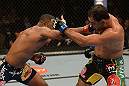 LAS VEGAS, NV - FEBRUARY 02:  (L-R) Rashad Evans punches Antonio Rogerio Nogueira during their light heavyweight fight at UFC 156 on February 2, 2013 at the Mandalay Bay Events Center in Las Vegas, Nevada.  (Photo by Donald Miralle/Zuffa LLC/Zuffa LLC via Getty Images) *** Local Caption *** Rashad Evans; Antonio Rogerio Nogueira