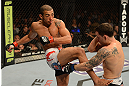 LAS VEGAS, NV - FEBRUARY 02:  (L-R) Jose Aldo kicks Frankie Edgar during their featherweight title fight at UFC 156 on February 2, 2013 at the Mandalay Bay Events Center in Las Vegas, Nevada.  (Photo by Donald Miralle/Zuffa LLC/Zuffa LLC via Getty Images) *** Local Caption *** Jose Aldo; Frankie Edgar