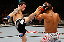 LAS VEGAS, NV - FEBRUARY 02:  (L-R) Frankie Edgar kicks Jose Aldo during their featherweight title fight at UFC 156 on February 2, 2013 at the Mandalay Bay Events Center in Las Vegas, Nevada.  (Photo by Josh Hedges/Zuffa LLC/Zuffa LLC via Getty Images) *** Local Caption *** Jose Aldo; Frankie Edgar