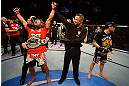 LAS VEGAS, NV - FEBRUARY 02:  Jose Aldo (left) reacts to his victory over Frankie Edgar (right) after their featherweight title fight at UFC 156 on February 2, 2013 at the Mandalay Bay Events Center in Las Vegas, Nevada.  (Photo by Josh Hedges/Zuffa LLC/Zuffa LLC via Getty Images) *** Local Caption *** Jose Aldo; Frankie Edgar