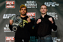 LONDON, ENGLAND - FEBRUARY 13:  (L-R) Opponents Renan Barao and Michael McDonald pose for photos during a UFC press conference on February 13, 2013 at Hooks Gym in London, England.  (Photo by Josh Hedges/Zuffa LLC/Zuffa LLC via Getty Images)