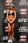 LONDON, ENGLAND - FEBRUARY 15:  UFC Octagon Girl Carly Baker stands on stage during the UFC weigh-in on February 15, 2013 at Wembley Arena in London, England.  (Photo by Josh Hedges/Zuffa LLC/Zuffa LLC via Getty Images)