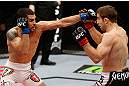 LONDON, ENGLAND - FEBRUARY 16:  (L-R) Ulysses Gomez punches Phil Harris in their flyweight fight during the UFC on Fuel TV event on February 16, 2013 at Wembley Arena in London, England.  (Photo by Josh Hedges/Zuffa LLC/Zuffa LLC via Getty Images)